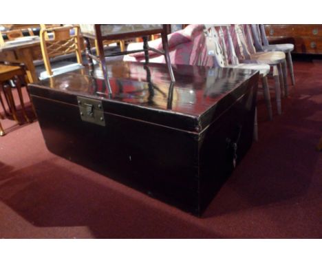 An Eastern lacquered trunk with twin handles 