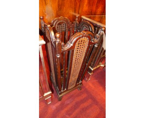 A 1910 oak and caned stick stand 