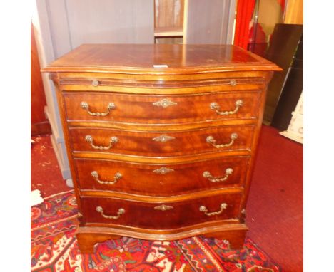A Georgian style mahogany serpentine fronted bachelors chest fitted brushing slide and four drawers on bracket feet