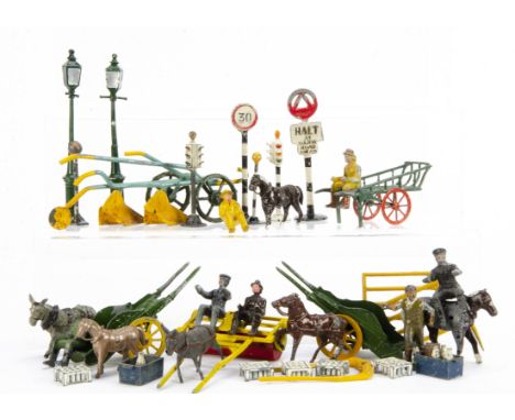 Various lead carts by Charbens (2) and Britains,  (2, both P), a handcart, Taylor &amp; Barrett (2, both P), tractor drivers 