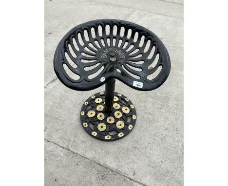 A BAR STOOL CREATED FROM A REFURBISHED BAMFORDS TRACTOR SEAT 