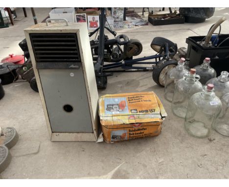 AN ELU ELECTRIC BELT SANDER AND AN ALADDIN HEATER 