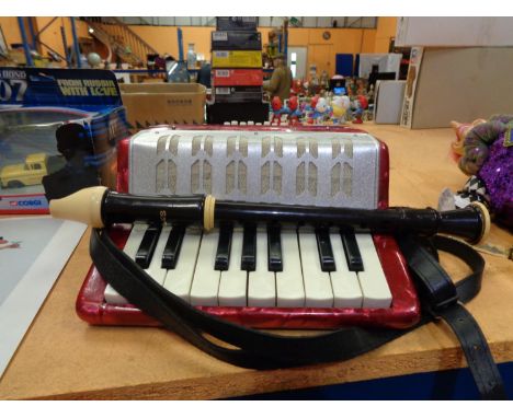 A CHILDS ACCORDIAN AND A RECORDER 