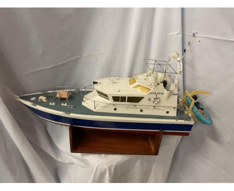 A RADIO CONTROLLED MODEL BOAT - A POLICE LAUNCH "SHAMROCK"  1:24 SCALE. APPROX DIMENSIONS - LENGTH 68 CM, HEIGHT 38 CM, WIDTH