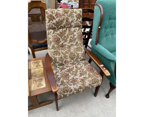 A PARKER KNOLL FIRESIDE CHAIR MODEL P.K.1067-70 