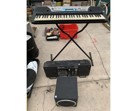 A YAMAHA ORGAN, SANYO STEREO RECORDER AND AN EDIFIER SPEAKER 