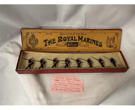 A BOXED BRITIANS ROYAL MARINES EIGHT PIECE MODEL SOLDIER SET - NUMBER 35 BELIEVED 1928 VINTAGE  (BOX IN AGED CONDITION) 