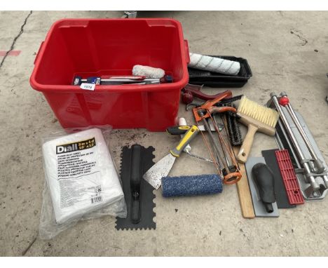 AN ASSORTMENT OF TOOLS TO INCLUDE A TILE CUTTER, PASTING BRUSHES AND CAULK GUNS ETC 