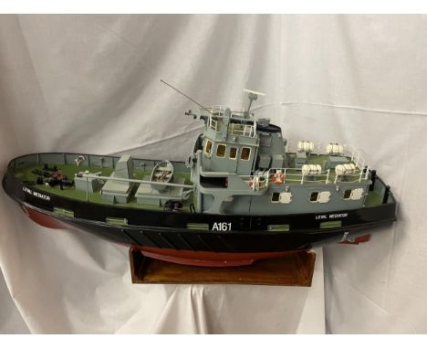 A RADIO CONTROLLED MODEL BOAT - A ROYAL NAVY FLEET TENDER "LOYAL MEDIATOR" BELIEVED 1:24 SCALE. APPROX DIMENSIONS - LENGTH 10