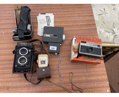 AN ASSORTMENT OF PHOTOGRAPHY EQUIPMENT TO INCLUDE A GOSSEN COLOR FINDER, A YASHICA MAT-124 CAMERA AND A CRESTLINE AUTOMATIC S