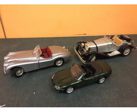 THREE LARGE DIECAST MODEL CARS TO INCLUDE TWO JAGUARS AND ONE MERCEDES 