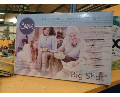 A SIZZIX BIG SHOT MANUAL SHAPE CUTTING AND EMBOSSING MACHINE 