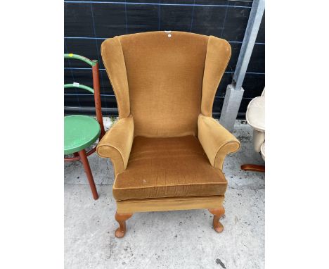 A PARKER KNOLL WINGED EASY CHAIR ON CABRIOLE LEGS, MODEL P.K.720 MK.3 