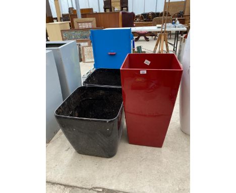 A PAIR OF SQUARE BLACK FIBRE GLASS PLANTERS (H:46CM) AND A FURTHER TALL RED FIBRE GLASS PLANTER (H:75CM) 