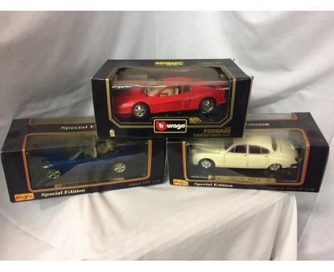 THREE BOXED 1:18 SCALE MODEL CARS - TWO MAISTO JAGUARS (AN XK8 AND A MARK II) AND A BURAGO FERRARI TESTAROSSA 