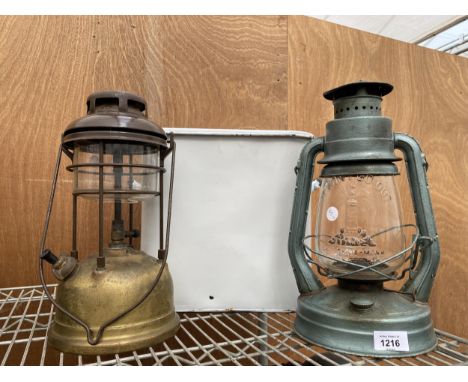 TWO VINTAGE PARAFIN LAMPS AND A WHITE ENAMEL BREAD BIN 