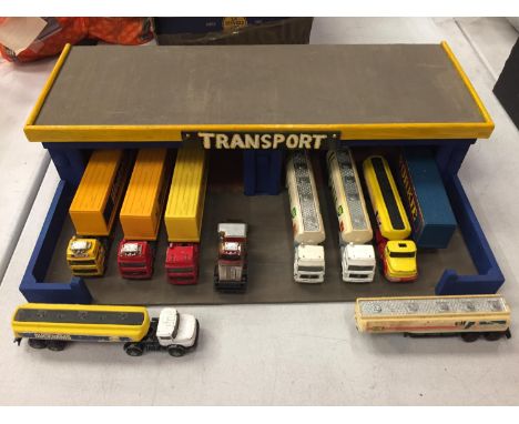 A WOODEN TRANSPORT GARAGE AND EIGHT CORGI LORRIES 