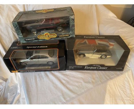 THREE BOXED 1:18 SCALE DIECAST MODEL CARS - A JAGUAR S TYPE, AUSTIN HEALEY 100 AND SHELBY GT-500 