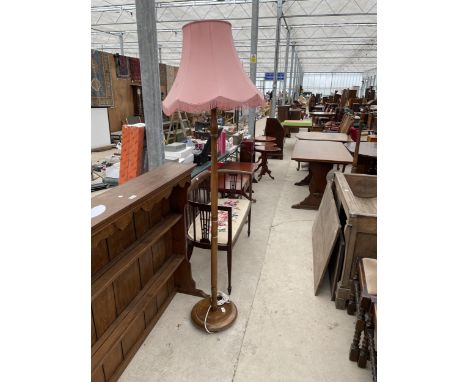 A STANDARD LAMP COMPLETE WITH SHADE 
