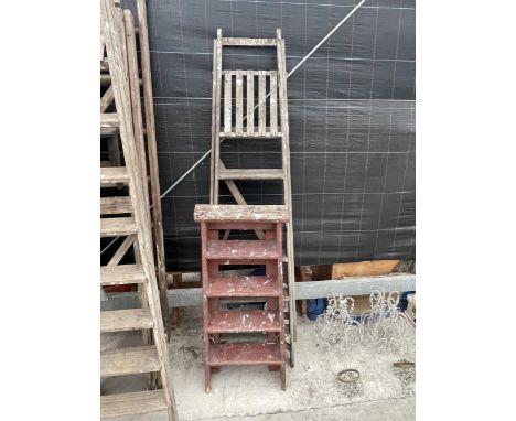A VINTAGE FIVE RUNG WOODEN STEP LADDER AND A FURTHER FOUR RUNG WOODEN STEP LADDER 