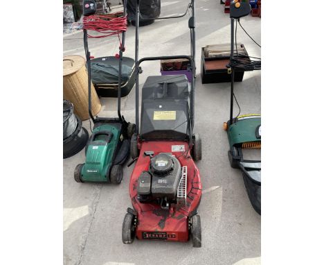 A CHAMPION SELF PROPELLED PETROL LAWN MOWER WITH BRIGGS AND STRATTON ENGINE AND GRASS BOX 