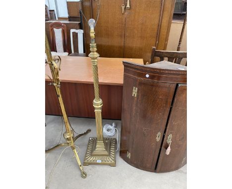 AN IMPRESSIVE BRASS STANDARD LAMP ON SQUARE PLATFORM BASE, WITH PARTIALLY KNURLED COLUMN, COMPLETE WITH SHADE 