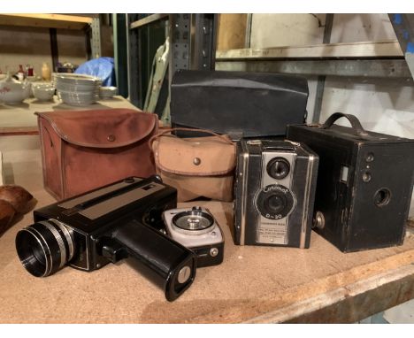 THREE VINTAGE CAMERAS AND THREE CASES TO INCLUDE A CHINON SUPER 8, A KODAK BROWNIE AND A CORONET D-20 