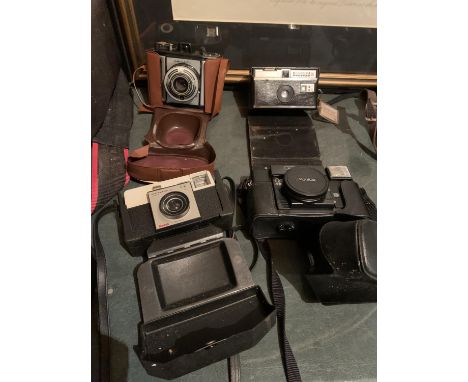 FOUR CAMERAS TO INCLUDE A KONICA AUTO FOCUS, A FELIC, A KODAK INSTAMATIC AND AN INSTAMATIC 50 