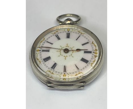 A LADIES SILVER FOB WATCH WITH ENAMEL FACE, ROMAN NUMERALS AND GILT DECORATION 