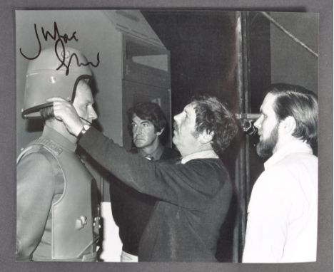 Private Collection of Julian Glover - an 8x10" black and white photograph taken on-set during a costume fitting with Mr Glove