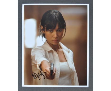 The Julian Glover Auction - Olga Kurylenko - James Bond The Quantum Of Solice - autographed 8x10" colour photograph from the 