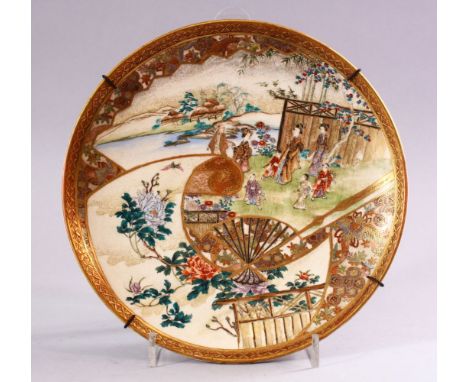A FINE JAPANESE MEIJI PERIOD SATSUMA PLATE,  decorated with panel views of figures in landscapes, native floral display and g