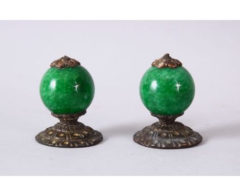 A PAIR OF CHINESE CARVED HARDSTONE &amp; METAL FINIAL / TOPS, the finial each with a nice green carved hardstone ( possibly J