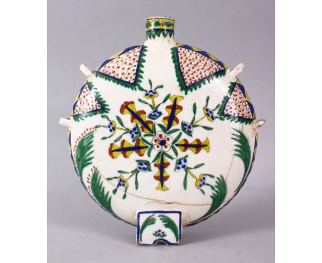 A 19TH CENTURY TURKISH POTTERY KUTAHYA WATER FLASK, decorated with floral motif decoration, 22cm high x 19.5cm wide.