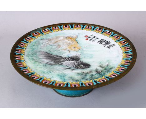 A 19TH/20TH CENTURY CHINESE CLOISONNE ENAMEL TWIN FISH STEMMED DISH, the centre decorated with twin swimming goldfish beneath