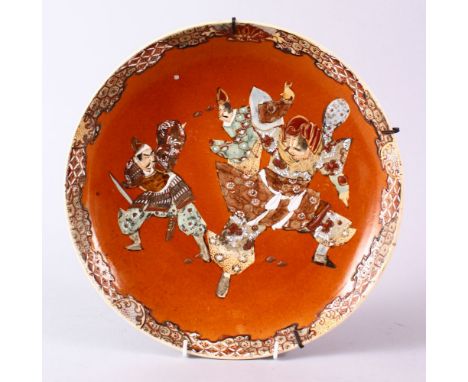A JAPANESE MEIJI PERIOD SATSUMA DISH, decorated with three warriors in raised enamel, 31.5cm diameter.