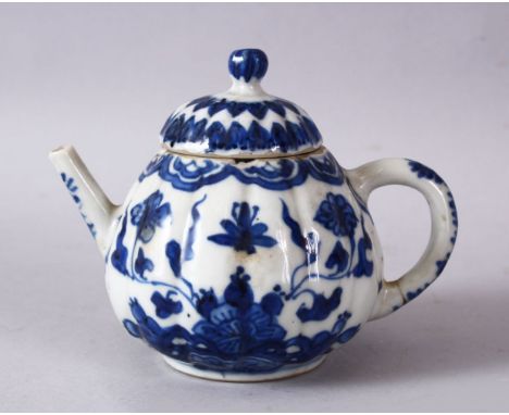 A 19TH / 20TH CENTURY CHINESE BLUE &amp; WHITE PORCELAIN TEAPOT, decorated with f lotus display, and floral bands, 10cm x 13c