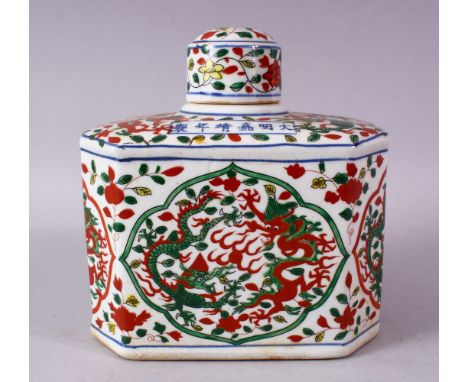A CHINESE WUCAI DECORATED PORCELAIN TEA CADDY &amp; COVER, decorated with panels of dragons and flora, the top with a sic cha