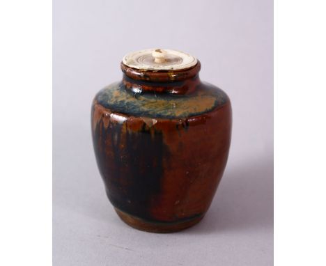 A JAPANESE MEIJI PERIOD POTTERY TEA CADDY / JAR AND IVORY COVER, with a drip glaze base and ivory cover, collection label to 