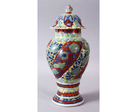 A 19TH / 20TH CENTURY CHINESE KANGXI STYLE PORCELAIN RIBBED VASE AND COVER, With underglaze blue decoration and areas of late