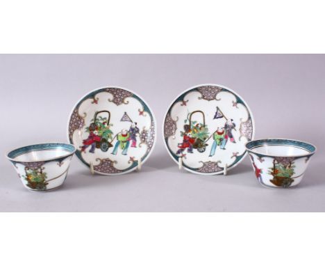 A PAIR OF CHINESE FAMILLE ROSE TEA BOWLS AND SAUCERS, decorated with figures.