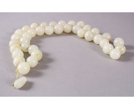 A GOOD SET OF CHINESE CARVED WHITE JADE BEAD NECKLACE, comprising 37 carved beads and a toggle, approx. measurement : 66cm.