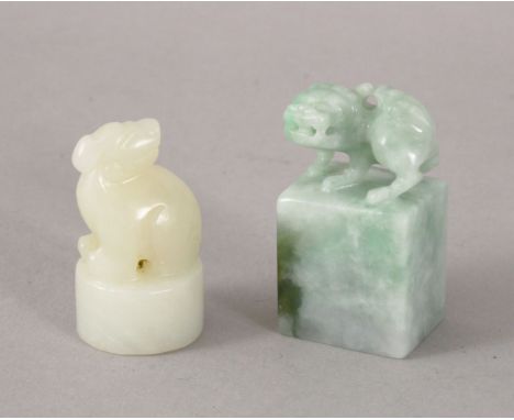 TWO 19TH / 20TH CENTURY CHINESE CARVED JADE / JADEITE SEALS, one white jade depicting a kylin, the underside with carved call