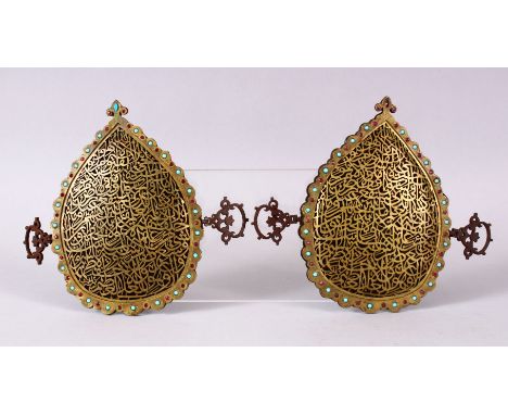 A PAIR OF 19TH CENTURY ISLAMIC GILT METAL OPENWORK CALLIGRAPHIC PANELS, inlaid with turquoise and ruby like stones, with open