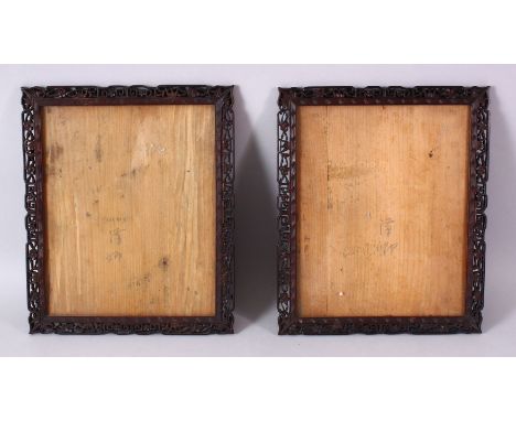 A PAIR OF 19TH CENTURY CHINESE CARVED WOOD PICTURE FRAMES, carved with prunus and scroll decoration, 30cm x 25cm.