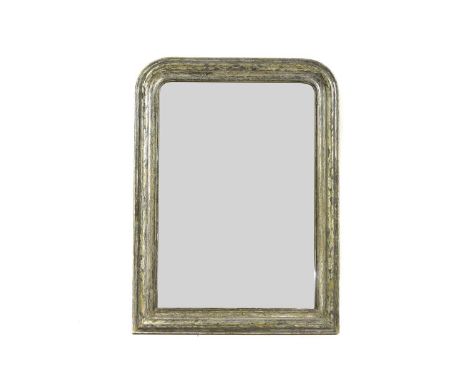 A silvered wooden pier mirror late 19th/ early 20th century,French, with an incised frame,79cm wide107cm highProvenance: The 