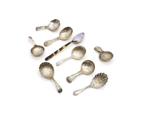 A group of silver caddy spoons to include a George III example by Walter Brind, London 1790, with shell bowl, etched with Sai