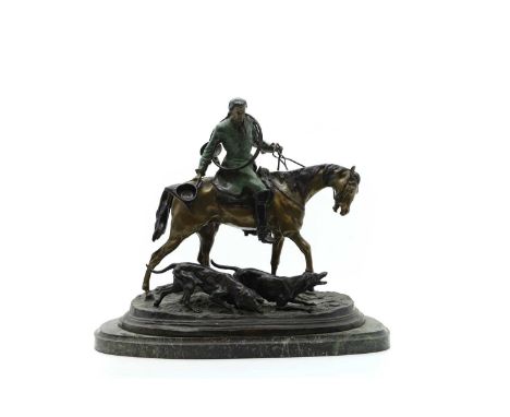 After Pierre Joules Mene a large bronze modelled as a French horseman leading two hounds, on a green marble base, signed, 52c