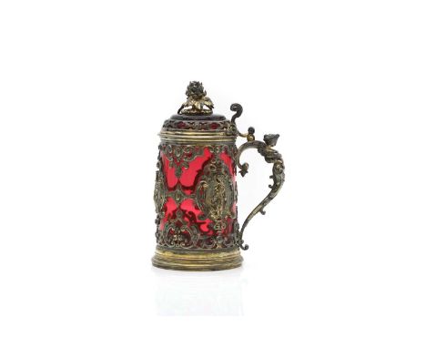 A Renaissance revival ruby glass and gilt metalmounted tankard,  19th century, with figural cartouche panels 18.2cm high    C