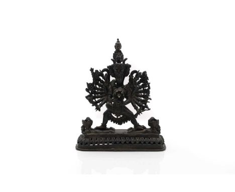 A sino-Tibetan bronze Buddhist sculpture, 20th century, of Vajrabhairava and Vajravetali locked in a passionate embrace, stan